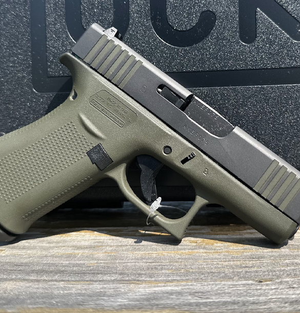 Green colored handguns